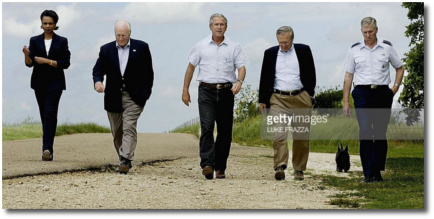 Cheney, Bush and Rumsfeld trying to walk with a tough-guy swagger at Bush's ranch Aug 23, 2004